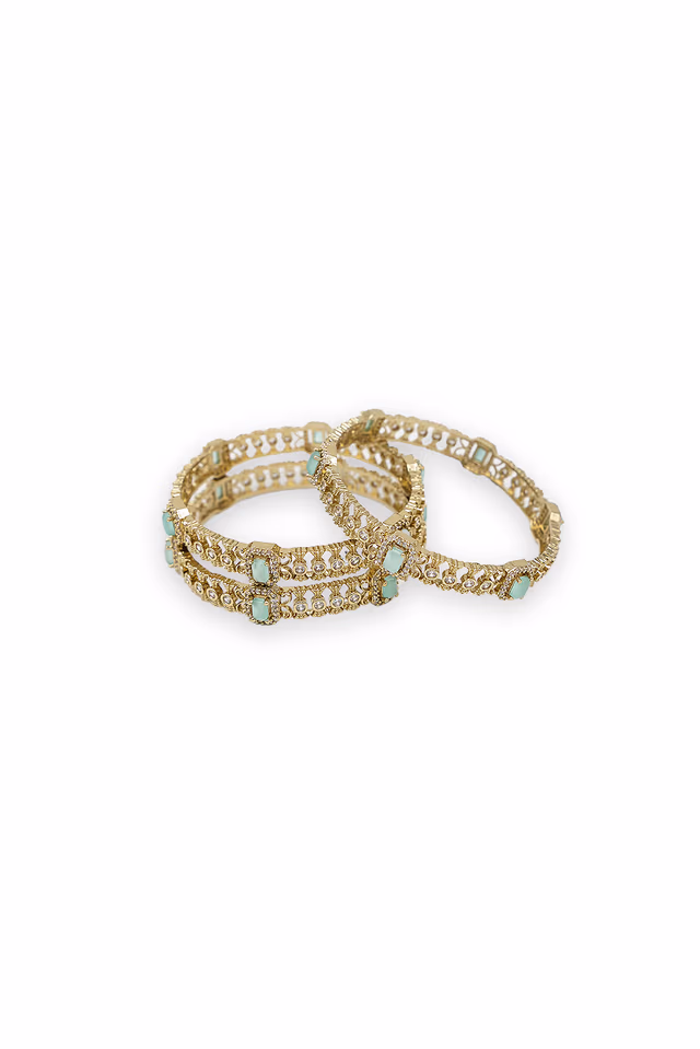 Experience The Sophistication Of Fine Craftsmanship With These Dainty Golden Bangles Studded With High… — rent in Calicut