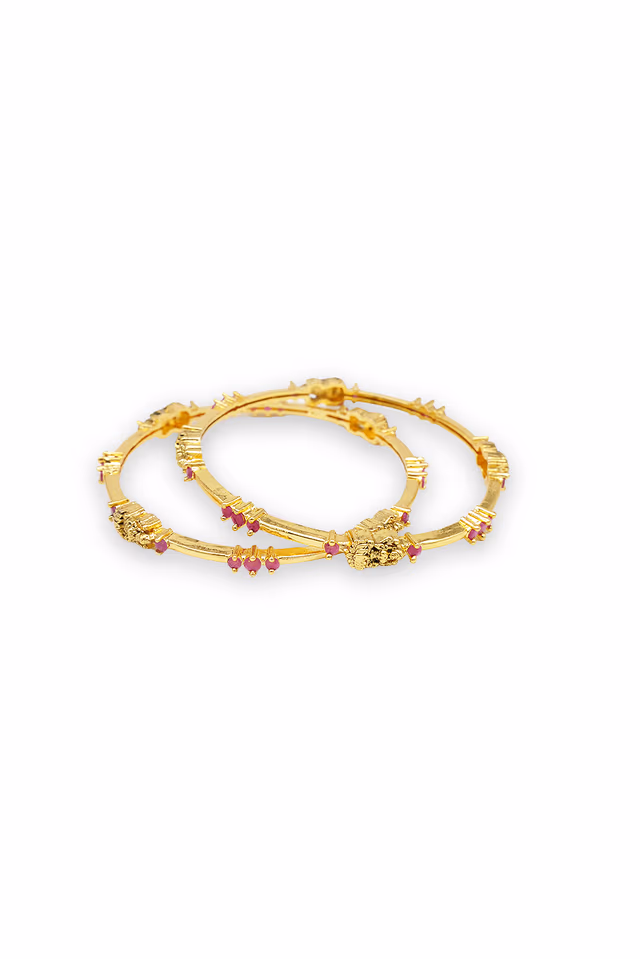 Ornate Golden Statement Bangle Displays Exquisite Craftsmanship With Detailed Elephant Motifs And… — rent in Coimbatore