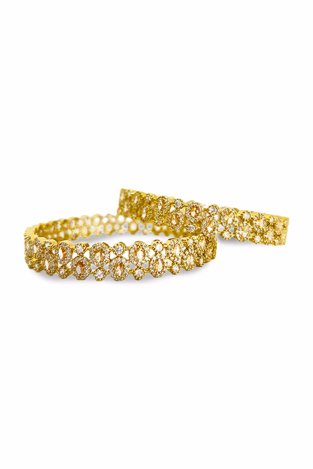 Elegant bangle with surrounding micro-stone embellishments catch the light from every angle, ensuring a… — rent in Bangalore
