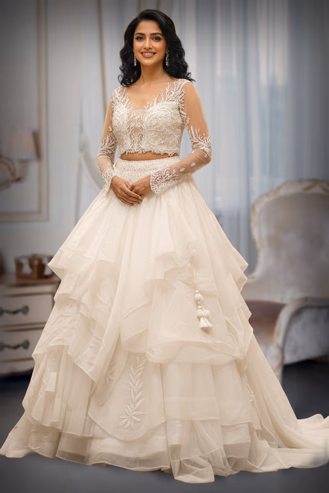 Off White Organza Tiered Ruffle Lehenga with Sheer Embroidered Blouse — back view, rent in Kochi