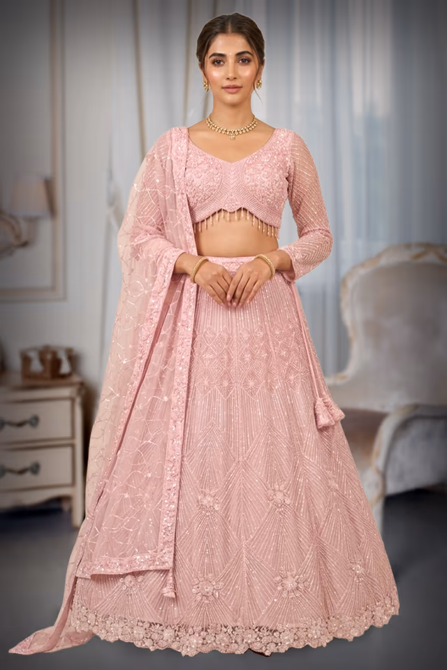 Pastel Pink Hand-Embellished Lehenga Choli with Geometric Sequin Pattern and Tassel Detail — back view, rent in Kochi