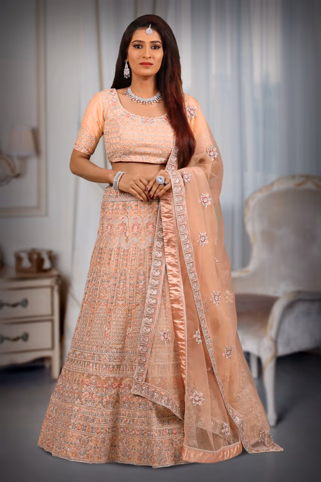 Peach silver thread & jarakan stone work lehenga — back view, rent in Coimbatore