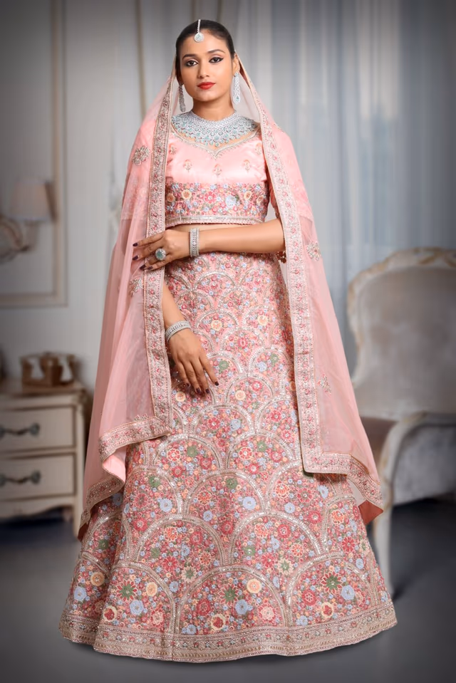 Pink multi color embroidery work lehenga — back view, rent in Calicut