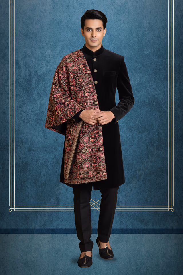 Exquisite Black Velvet Sherwani Featuring Vintage Metallic Buttons Paired With A Luxurious Intricately… — rent in Calicut