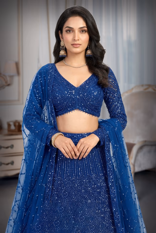 Exquisite Royal Blue Lehenga Set Featuring Shimmering All-Over Sequins, Matching Choli, And A Tulle Dupatta — rent in Calicut