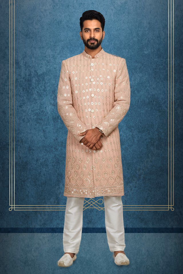 Pastel Peach Grooms Sherwani With Work On Front And White Colour Pajama Pant — rent in Calicut
