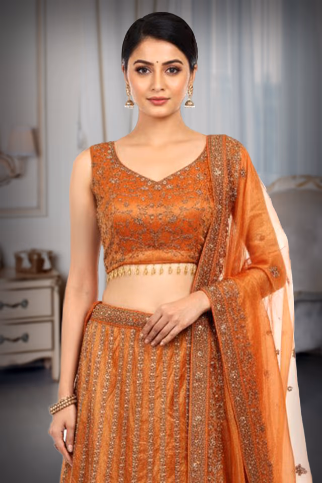 Orange Bridal Lehenga With Intricate Stone Work Details Along With Same Color Dupatta — rent in Calicut