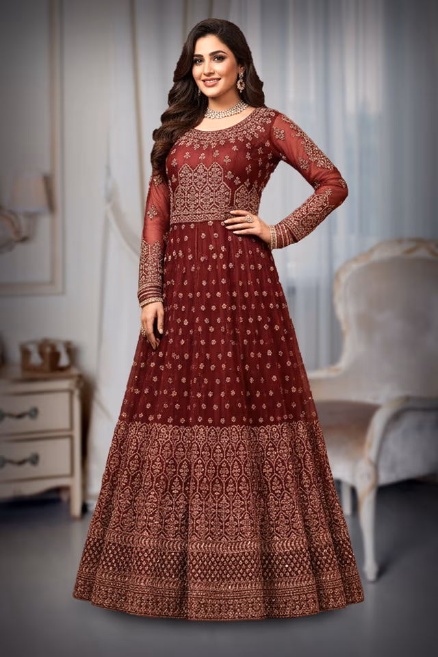 Red Anarkali Gown with Intricate Golden Embroidery and Sheer Sleeves. — rent in Kochi