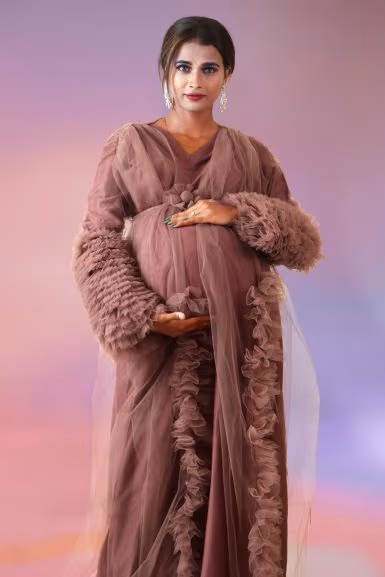 Pinkish brown ruffle sleeve robe open gown — rent in Calicut