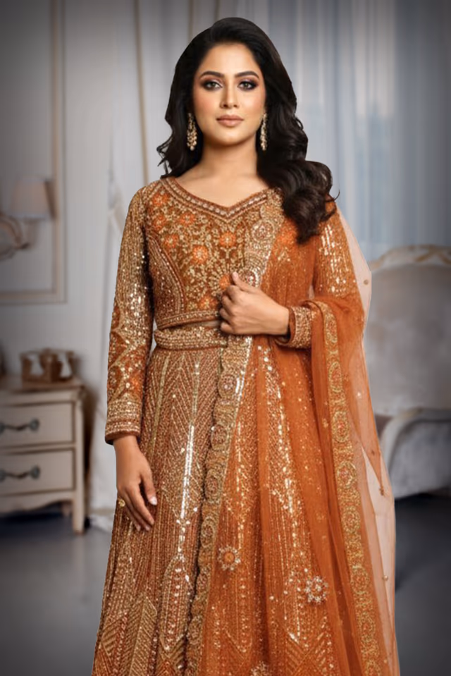 Exquisite Rust Orange Anarkali Features Intricate Sequin Embellishments Detailed Embroidery And A… — rent in Calicut