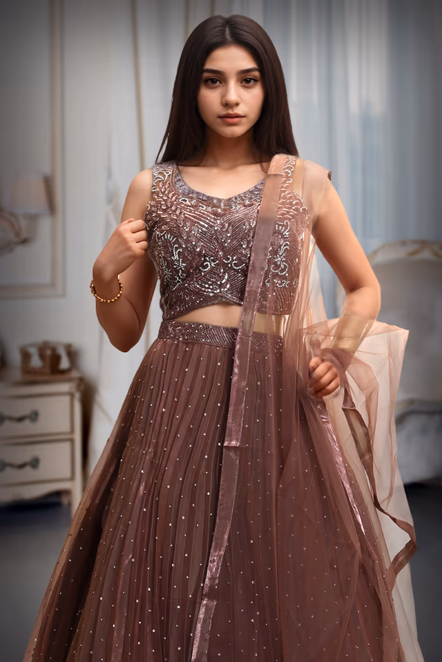 Rusty Brown Pre Wedding Lehenga With Uniform Stone Worked Skirt, Exquisite Stoneworked Crop Top Along With… — rent in Kochi