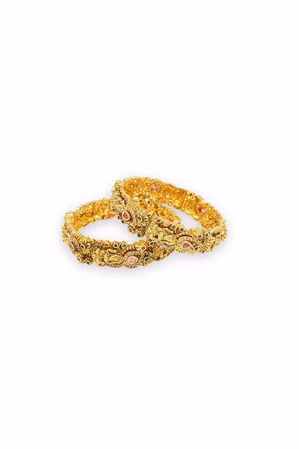 Bold Antique Bangle Decorated With Mythological Figures And Traditional Floral Patterns In Gold Tone — rent in Coimbatore