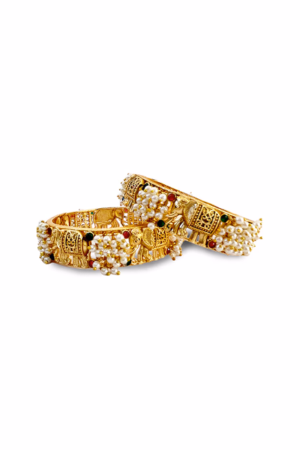 Enhance Your Bridal Look With These Radiant Golden Bangles Featuring Intricate Floral Metal Carvings — rent in Bangalore