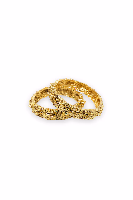 Magnificent Antique Gold Temple Bangle Featuring Intricate Divine Carvings And Small Vibrant Colored… — rent in Coimbatore