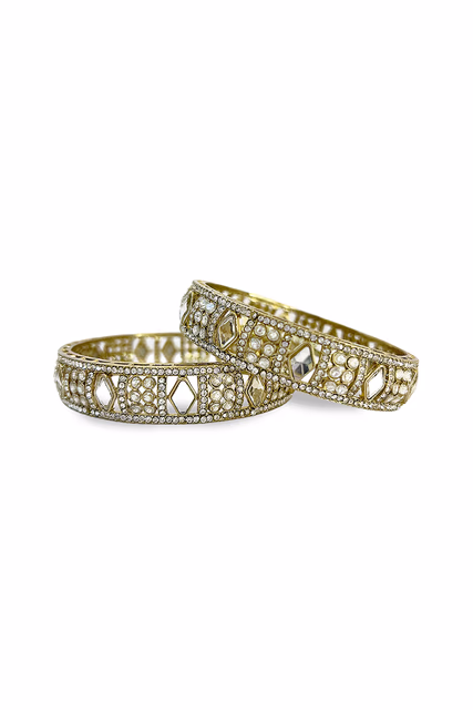 Elegant Gold Finished Bangles Featuring A Unique And Intricate Floral Pattern — rent in Bangalore