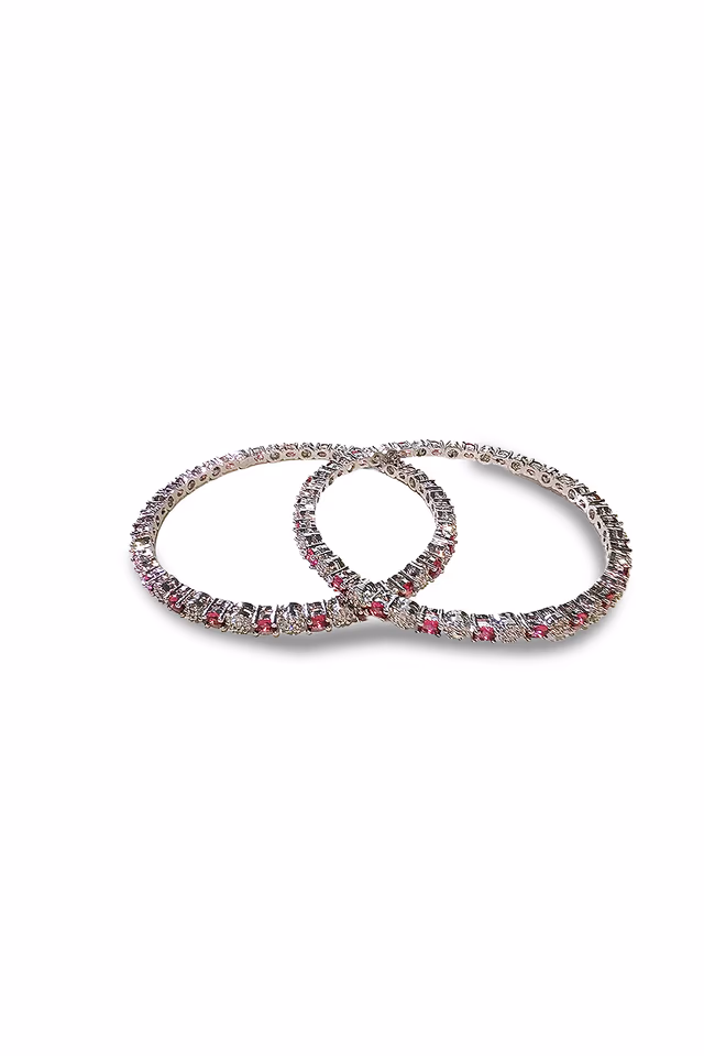 Radiant Ruby Pink Oval Stones Bring A Touch Of Nature Inspired Beauty To These Sparkling Silver Bangles — rent in Calicut