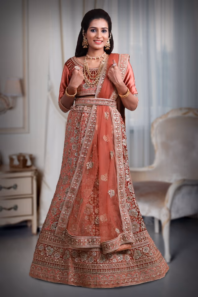 Dark Peach embroidery heavy border lehenga — back view, rent in Coimbatore