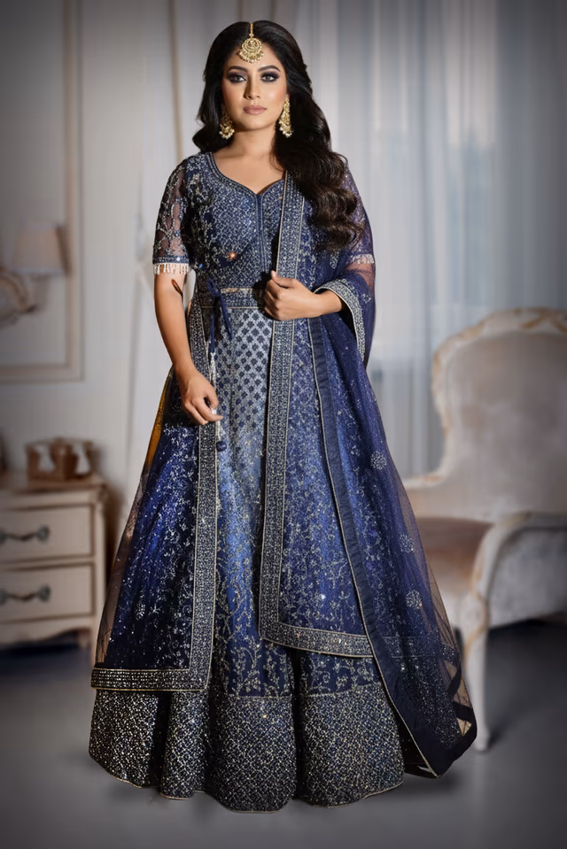 Exquisite Navy Blue Lehenga Featuring Intricate Silver Embroidery And Shimmering Stones… — back view, rent in Calicut