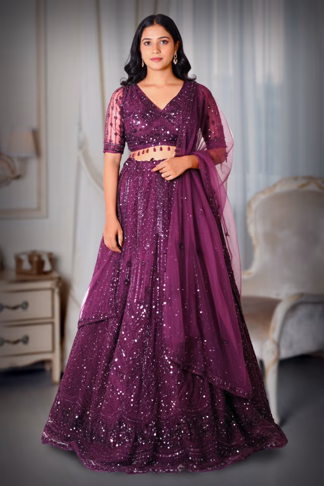 Grape Wine Heavy Embellished Bridal Lehenga With Golden Stone Details On Skirt , Crop Top And… — back view, rent in Calicut