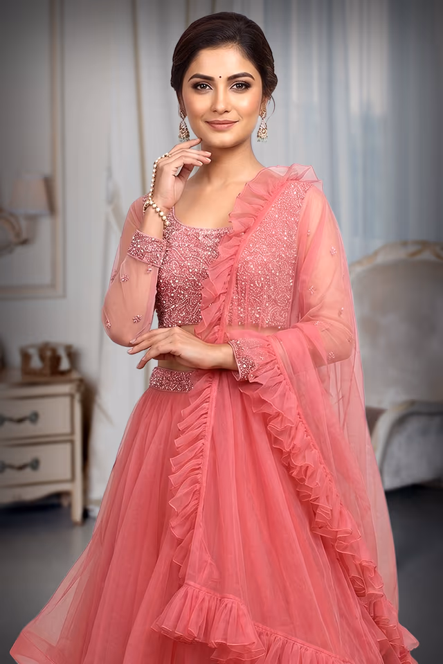 Hot Pink Net Lehenga With Frills Detailing In Skirt And Dupatta Along With Fully Hardworked Crop Top Blouse — rent in Calicut