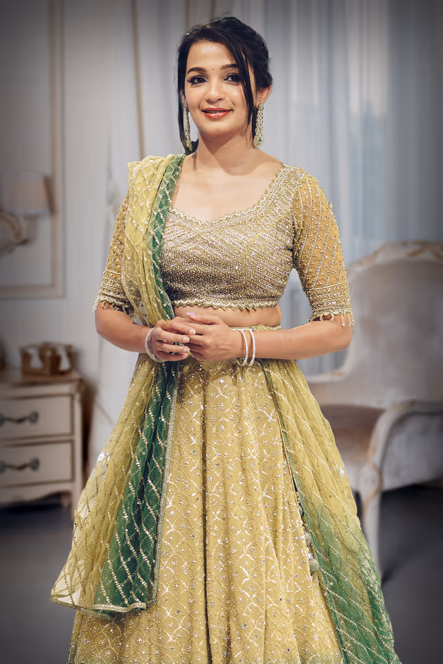 Metallic Green Heavy Embellished Bridal Lehenga With Golden Stone Details On Skirt , Crop Top And Dupatta — rent in Calicut
