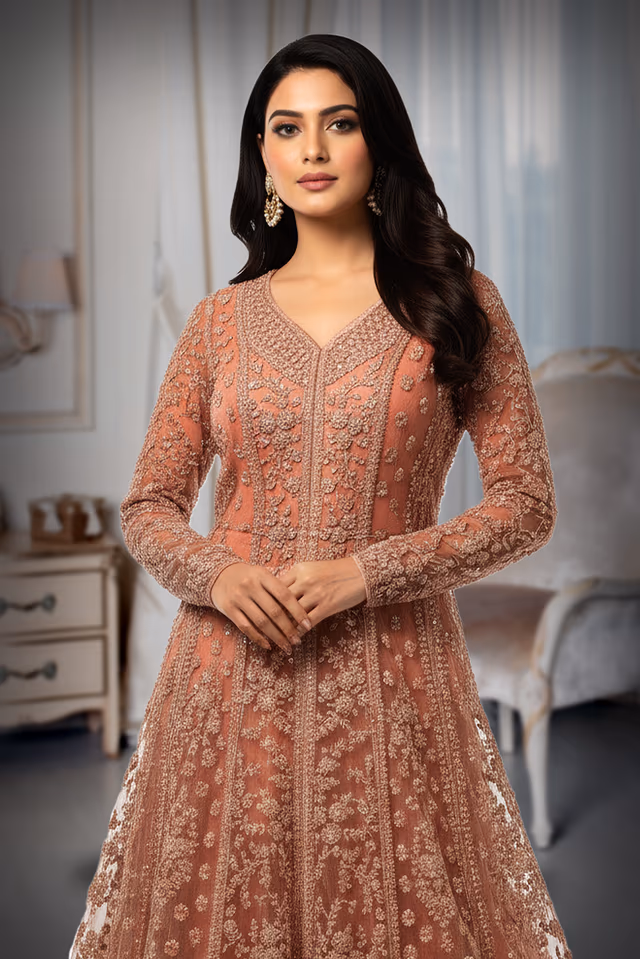 Pastel Peach Gown Features Intricate Stone Embellishments Detailed Embroidery And A Matching Sheer Net… — rent in Calicut