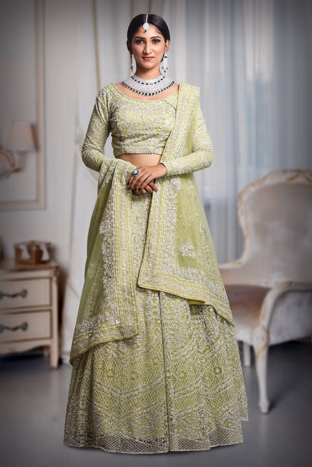 Pista green heavy thread work and jarkan stone work lehenga — back view, rent in Coimbatore