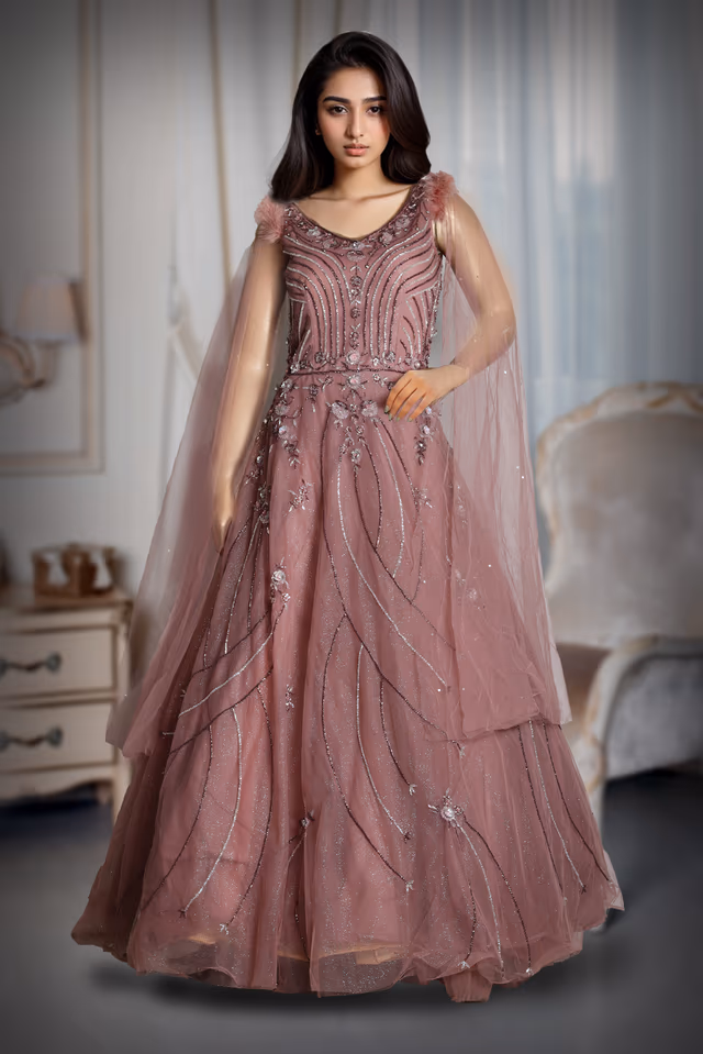 Dark Mauve Heavy Net Gown With Heavy Handwork Details And Shoulder Embellished With Feathers — back view, rent in Coimbatore