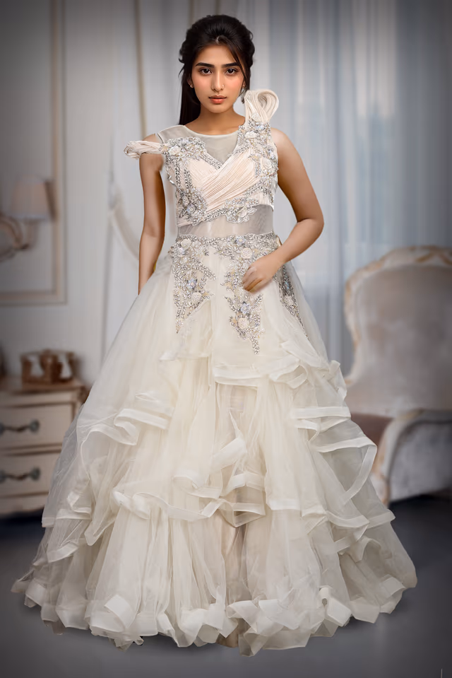 Ivory Colour Multi Flared Gown With Heavy Detailed Yoke Part And Transparent Waist — back view, rent in Coimbatore