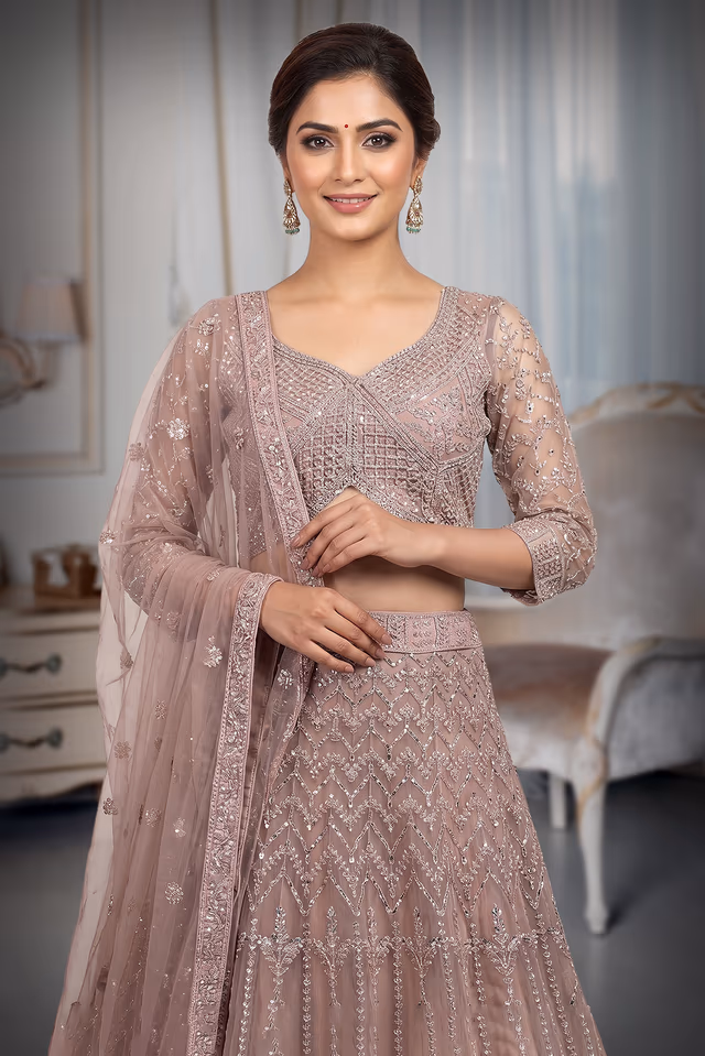 Mauve Net Lehenga With Intricate Stone Work And Threadwork Details — rent in Kochi