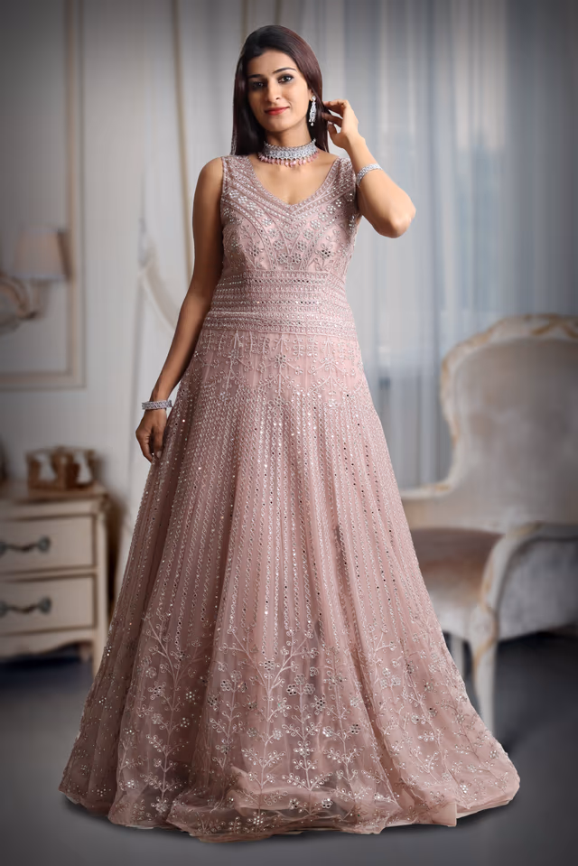 Pastel Peach Sleeveless Gown With Exquisite Stone Work Detailing — back view, rent in Coimbatore