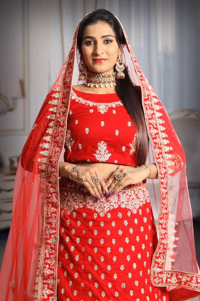 Red embroidery velvet lehenga — rent in Calicut