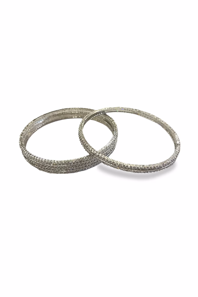 Shimmering Silver Tone Bangles Encrusted With Sparkling Stones Offering A Radiant Glow For Any Occasion — rent in Calicut