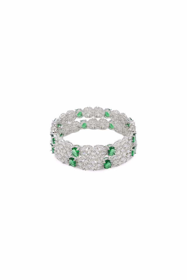 Exquisite Silver Toned Bangle Features Radiant Green Emerald Stones Set Within Sparkling White Crystal Patterns — view 1 of 1