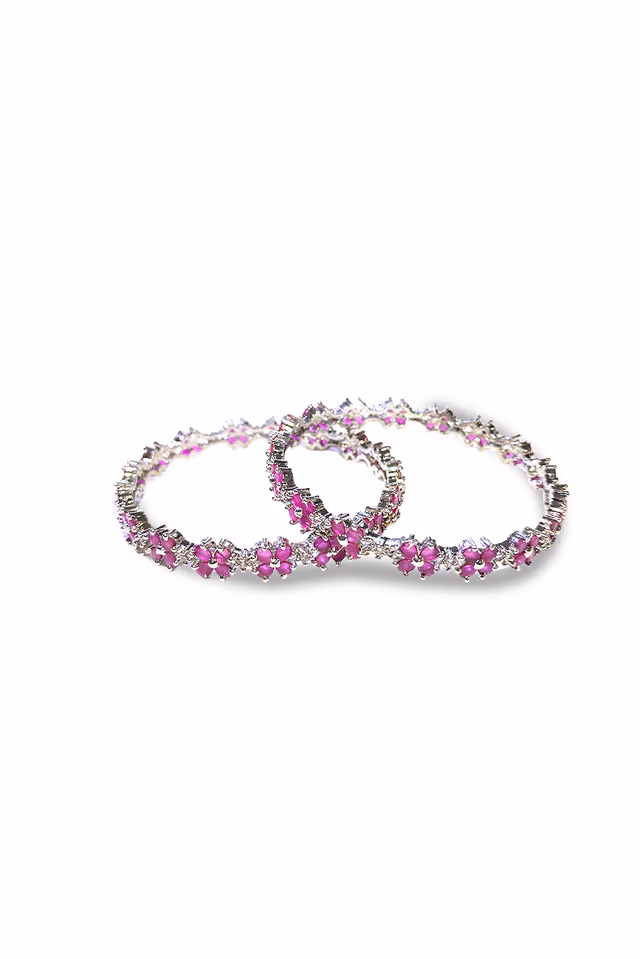Elegant Silver Finished Bangles Showcasing Majentha Oval Stones And Intricate Floral Inspired Sparkling… — rent in Calicut