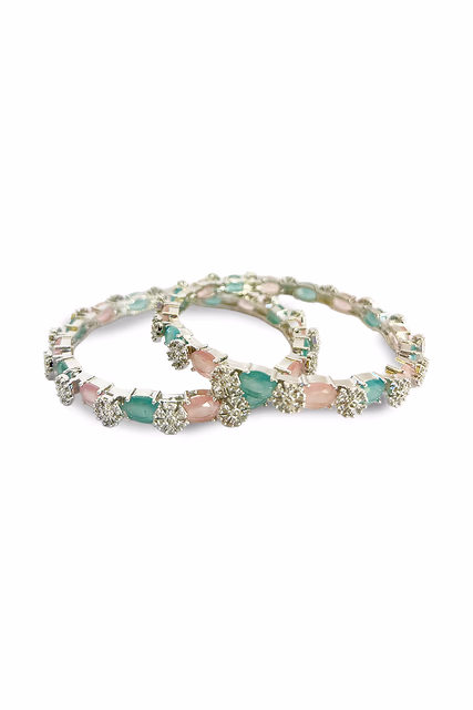 Radiant Silver Bangles Are Perfectly Embellished With Oval Pink And Green Stones For A Luxurious Finish — rent in Bangalore