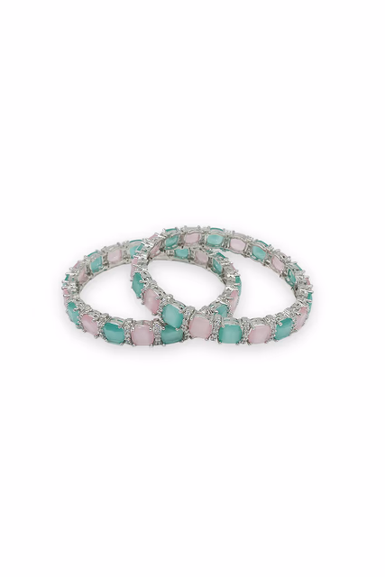 Radiant Silver Bangles Showcasing A Beautiful Pattern Of Pink And Green Clear Shimmering Stones — rent in Coimbatore