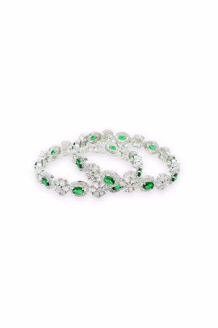 Sophisticated Bangles Showcase A Beautiful Alternating Pattern Of Clear And Vibrant Green Gemstones — rent in Bangalore