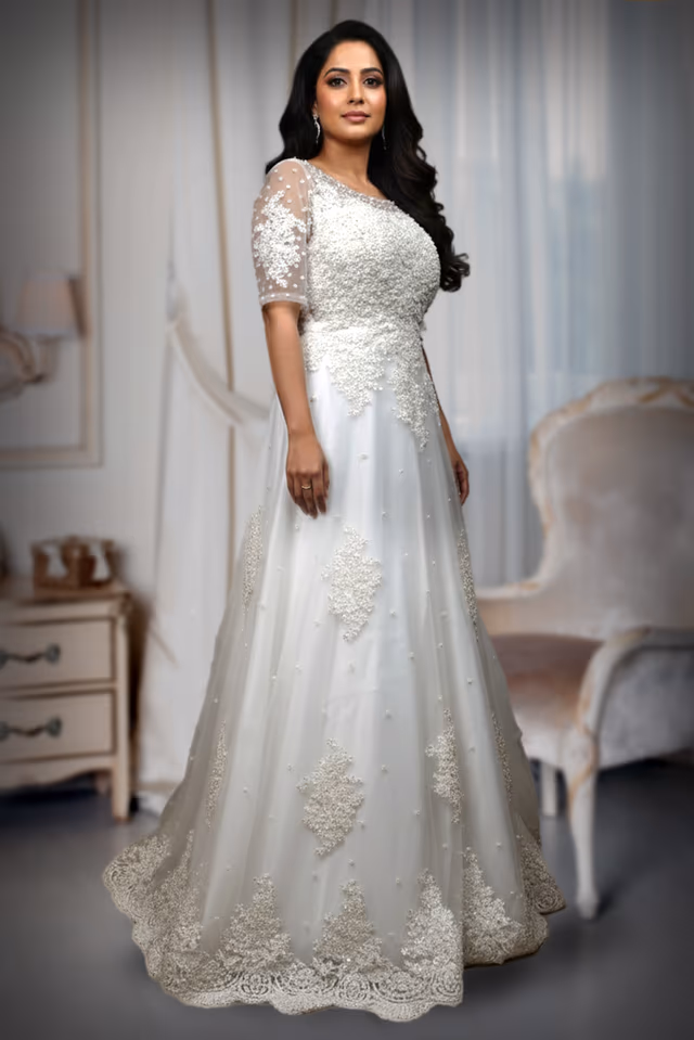 Elegant White Net Gown Adorned with Minimal Silver Stone and Thread Embroidery — back view, rent in Kochi