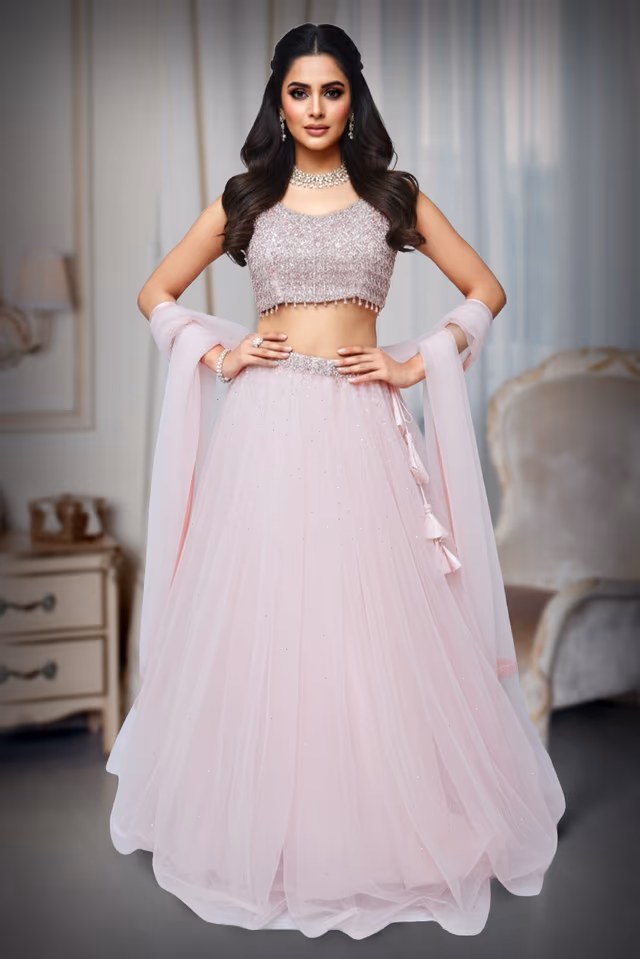 Baby pink lehenga with heavy crystal blouse with random sequence work. — back view, rent in Bangalore