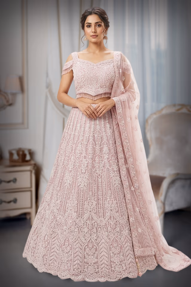 Blush pink heavy embroidered lehenga with elegnat net dupatta — back view, rent in Bangalore