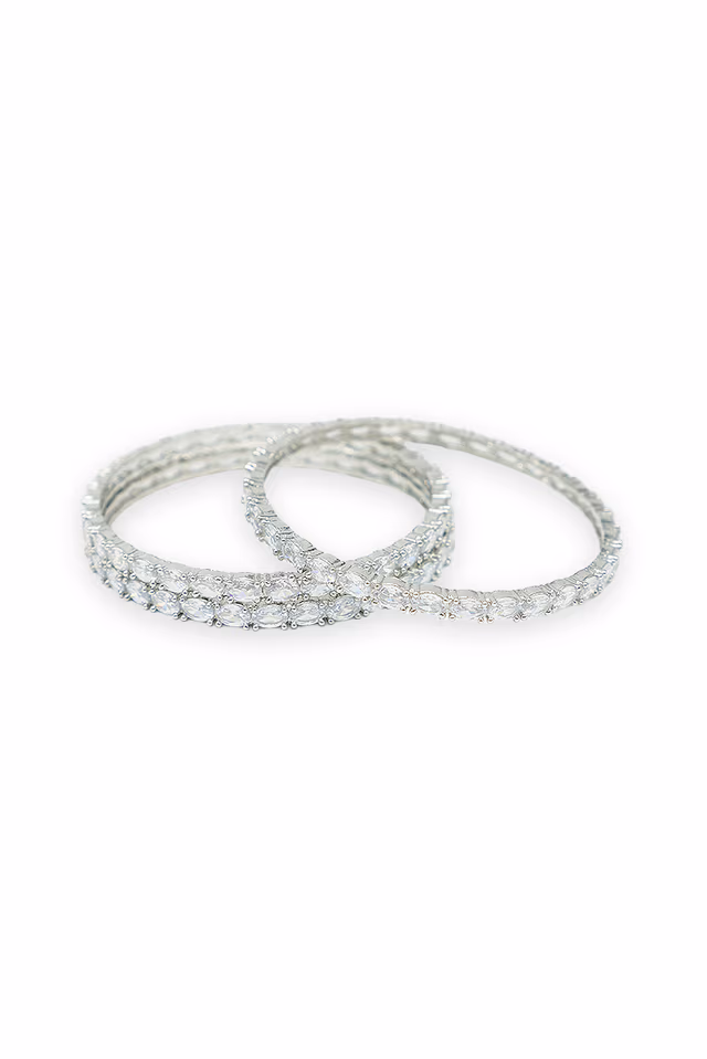 Discover The Brilliance Of These White Bangles Set In High Shine Polished Silver Floral Frames — rent in Bangalore
