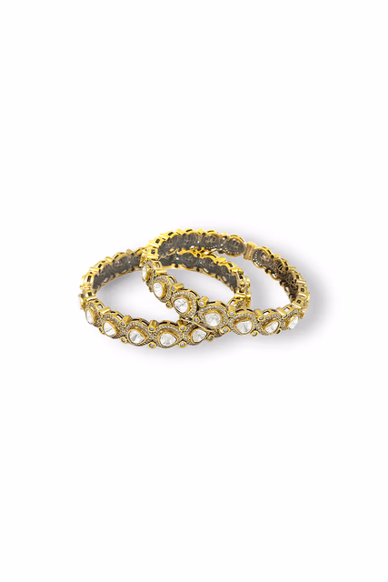 Sparkle With Tradition In These Exquisite Gold Toned Bangles Featuring Beautiful Circular Floral Clusters… — rent in Calicut